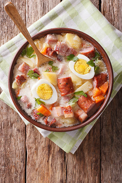 istock Zurek soup with smoked meat closeup on the table. Vertical 637859308