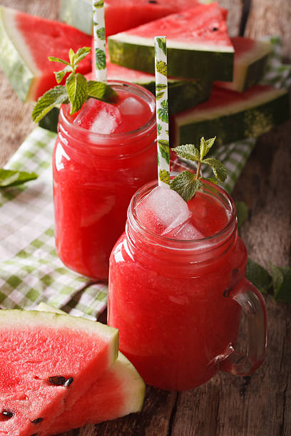 istock Tasty watermelon cocktail with ice and mint close up 637860712