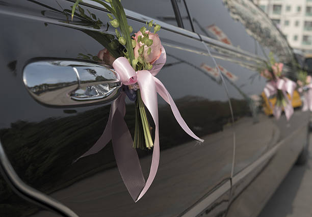 istock Flower on the black car. 637861448