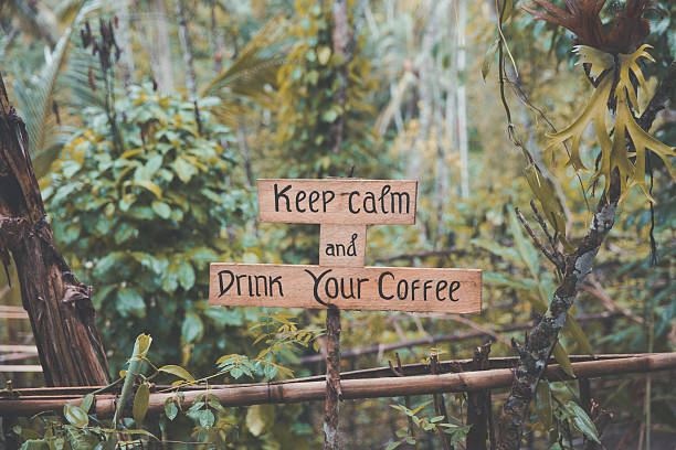 Coffee quotes in a rustic timber with jungle backgrounds