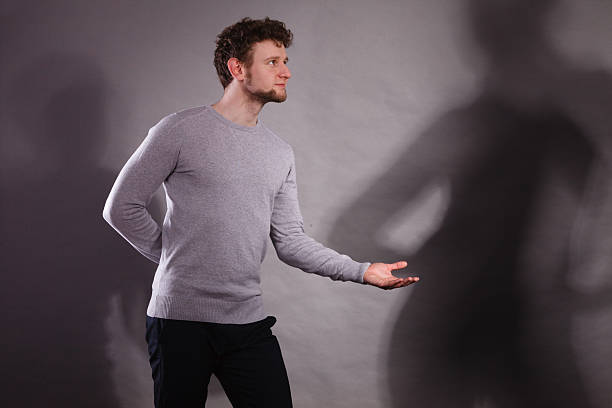 istock Man with shadow of gorgeous dancer. 637864662