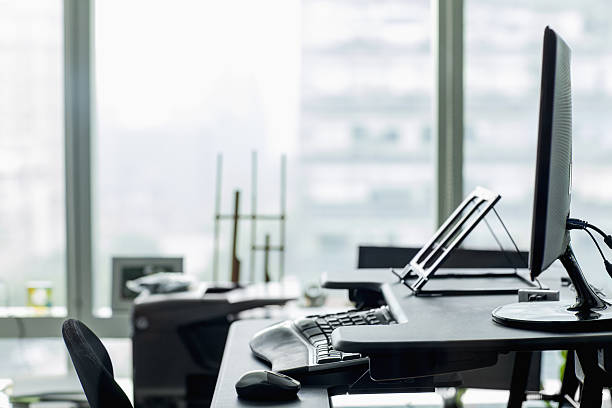istock View of desk and computer in technology office 637865164