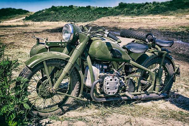 istock Old military motorcycle in green camouflage 637865830