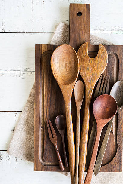 istock wooden utensil on white wooden table 637866150