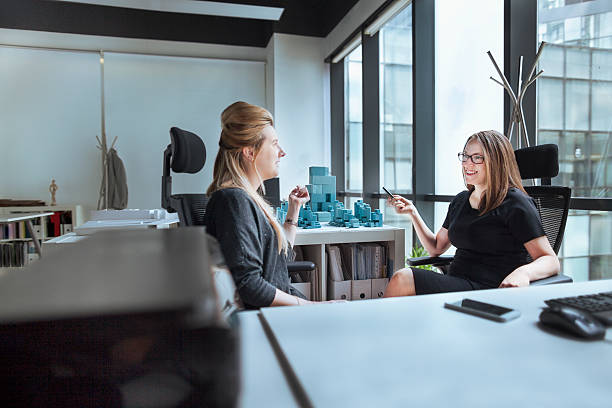 Women talking together in design office