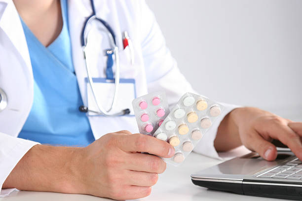 istock Hand of doctors holding many different pills 637869880