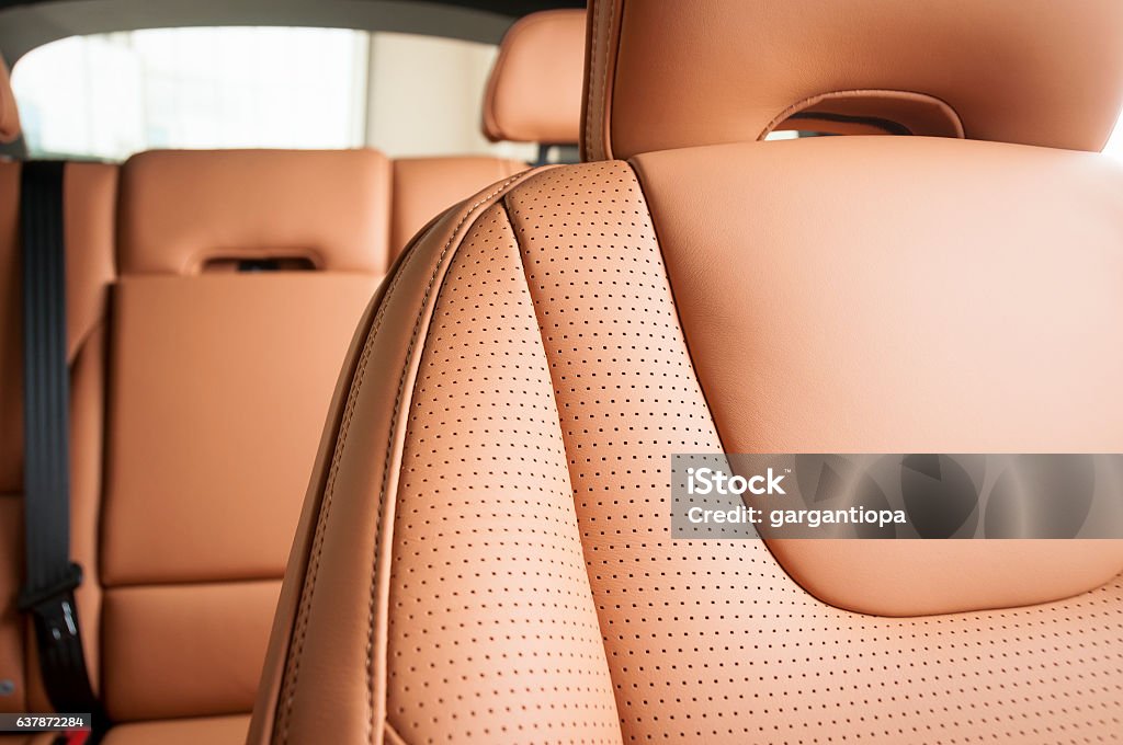 Leather car seats  detail with focus on stitch White leather car seats. Interior detail Car Stock Photo