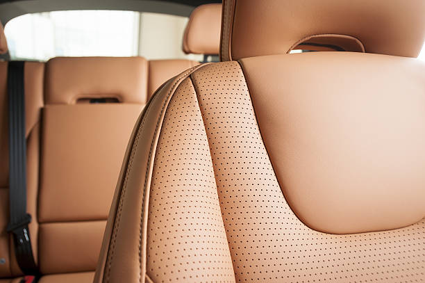 Leather car seats  detail with focus on stitch White leather car seats. Interior detail seat stock pictures, royalty-free photos & images