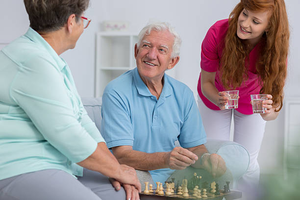 istock Caregiver and elderly couple 637874602