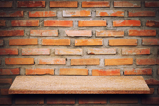 istock Empty top of natural stone shelves and stone wall background 637875782