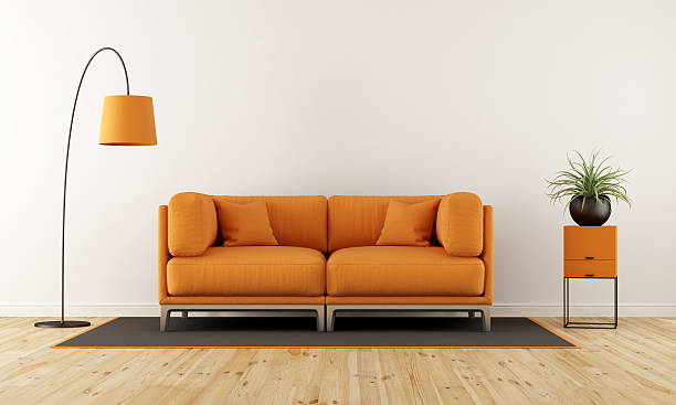 istock Modern living room with orange couch 637876746