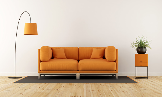 Modern living room with orange couch