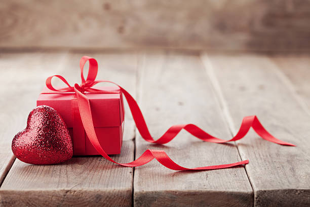 istock Glitter heart with gift or present box. Valentines day concept. 637877382