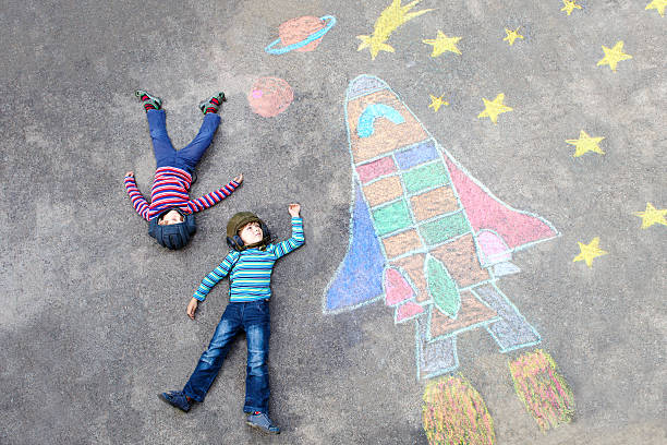 istock little kid boy flying by a space shuttle chalks picture 637877802