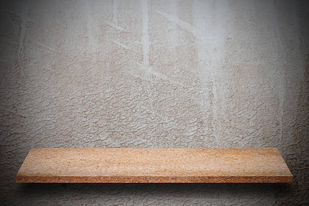 istock Empty top of natural stone shelves and stone wall background 637879258