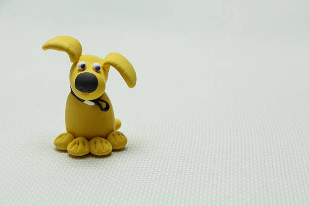 The dog mascot nodding on a shelf in an old car behind the window