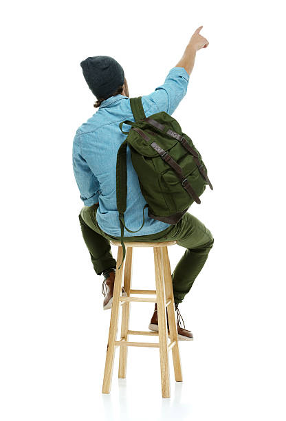 istock Rear view of hipster pointing away 637882694