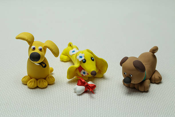 istock Three dogs and a bone tied up by a band 637883416
