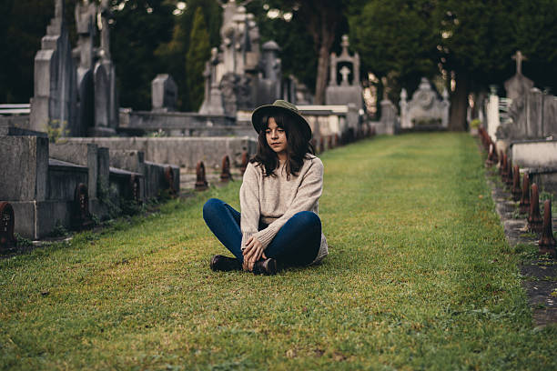 istock Young Woman at Cemetery 637887356