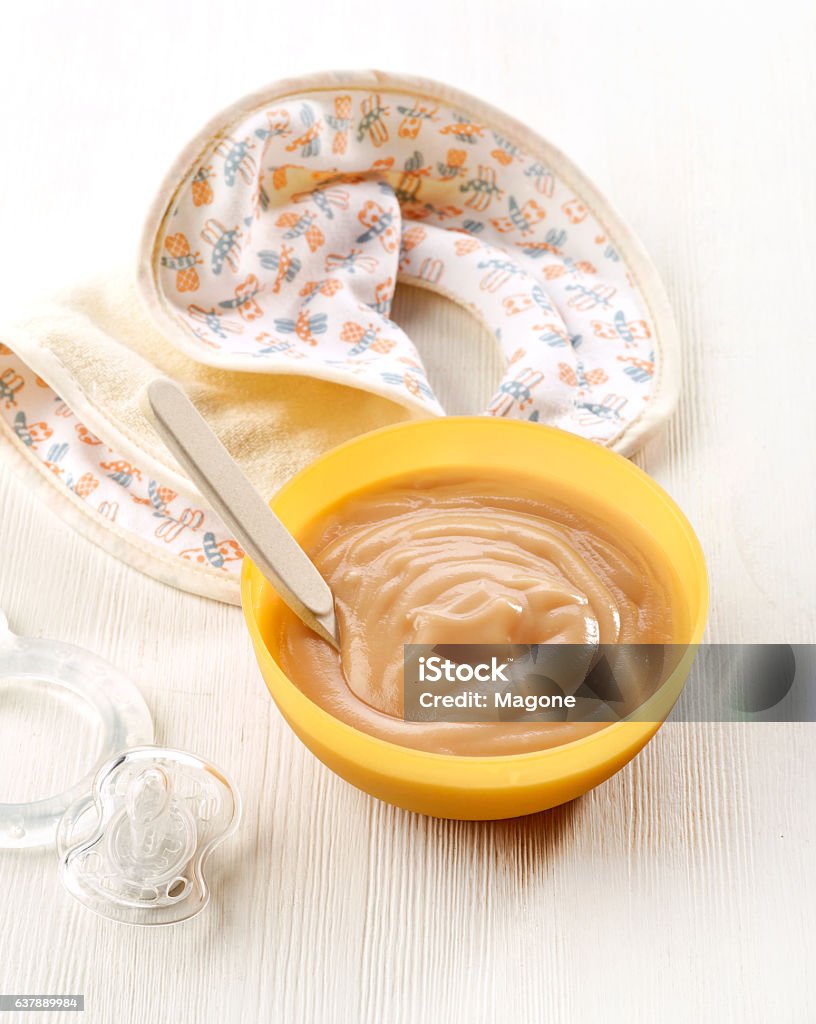 bowl of pureed aple bowl of pureed apple on white wooden table Baby Food Stock Photo