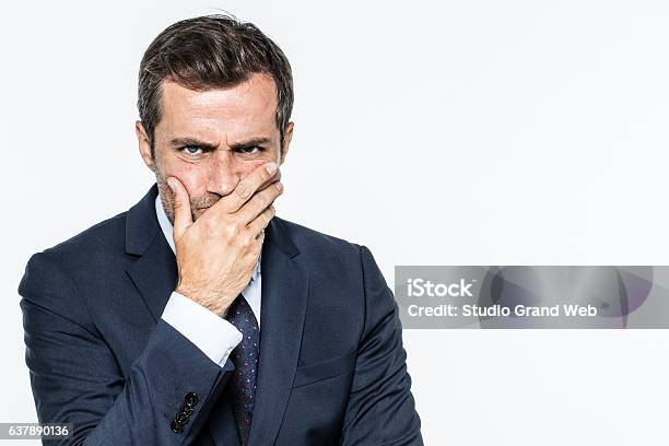 Frowning Unhappy Businessman Thinking Expressing Corporate Doubts And Concerns Stock Photo - Download Image Now