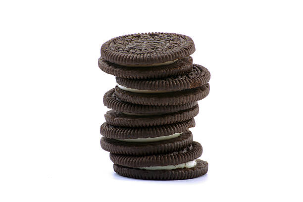 istock Chocolate cookies with cream filling isolated on white background. 637890850