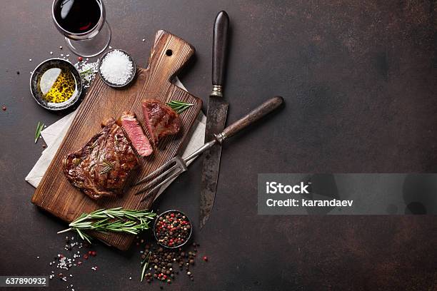 Grilled Ribeye Beef Steak With Red Wine Herbs And Spices Stock Photo - Download Image Now