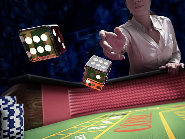 dices throw at casino - rolling dice imagens e fotografias de stock