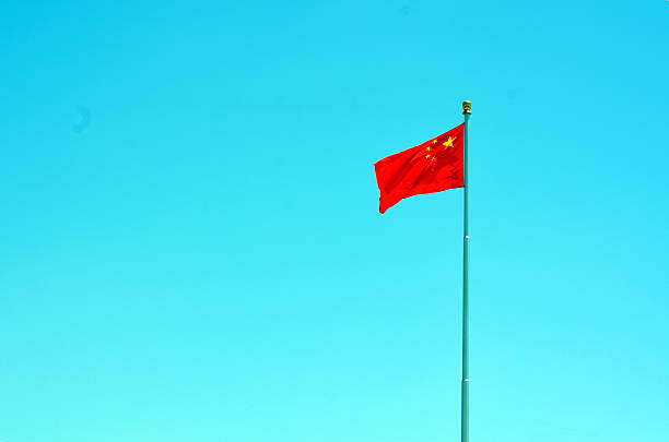 istock Chinese national flag waving on a clear day 637893654