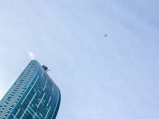 istock Plane flying over a skyscraper in downtown Toronto, Ontario, Canada 637894056