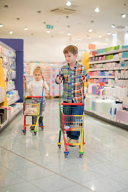 istock Kids shopping in supermarket 637895836