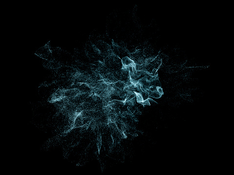 Beautiful dust particles explosion against a black background
