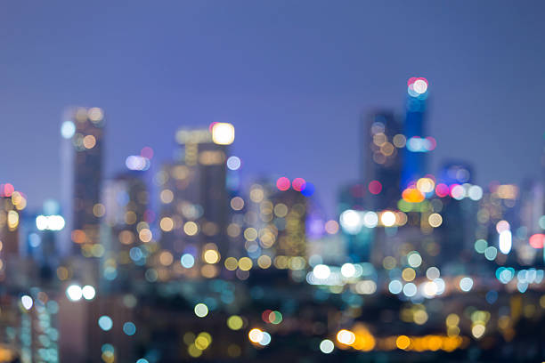 istock City blurred lights office building night view 637898656