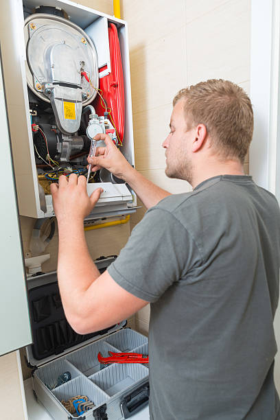 istock Technician repairing Gas Furnace 637899582