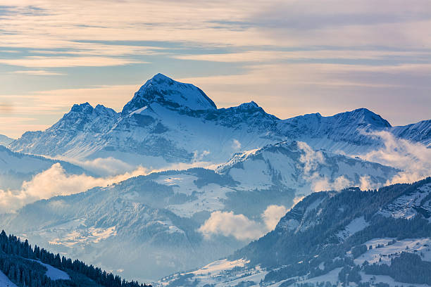 Winter Landscape Beautiful winter landscape in the Mont Blanc Massif with the view to the Chaine des Aravis above the clouds and villages. auvergne rhône alpes photos stock pictures, royalty-free photos & images