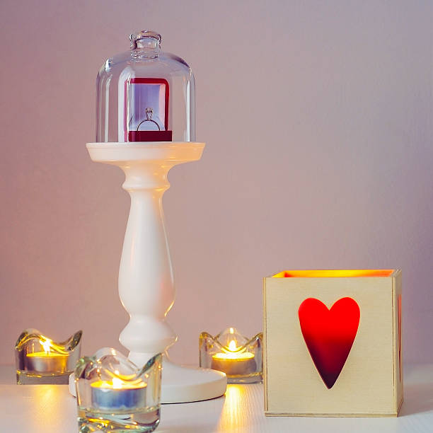 istock Engagement ring on a pedestal under glass cap 637900406