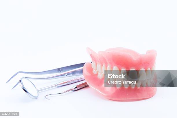 Teeth And Dental Mirror Symbol Photo Of Dentures Stock Photo - Download Image Now - Dentures, Restoring, Prosthetic Equipment