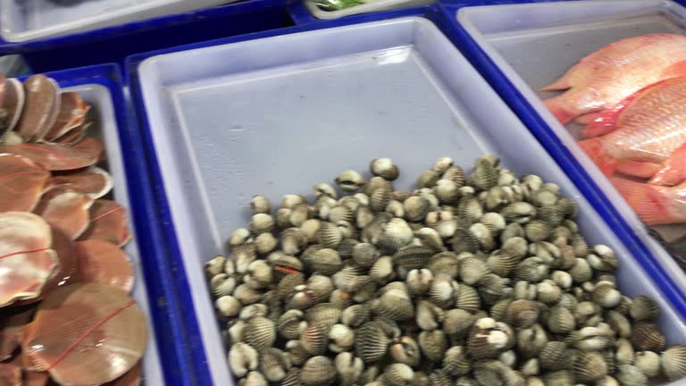 Choosing raw seafood for dinner , Pattaya , Thailand.