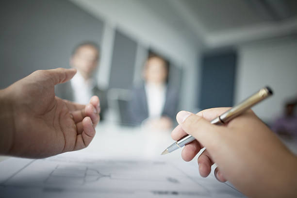 Close-up of hands gesturing during business meeting in office Close-up of hands gesturing during business meeting in office mediation stock pictures, royalty-free photos & images