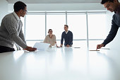 Business colleagues working together in meeting room