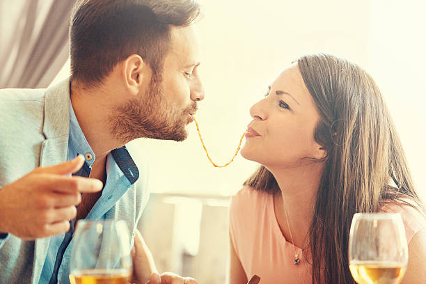 Happy Couple Eating Spaghetti stock photo