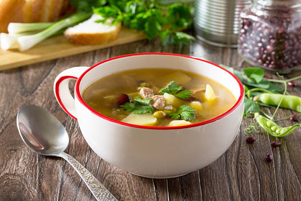 istock Soup with meat, beans, green peas and fresh vegetables 637907130
