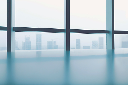 View of cityscape through windows in urban office