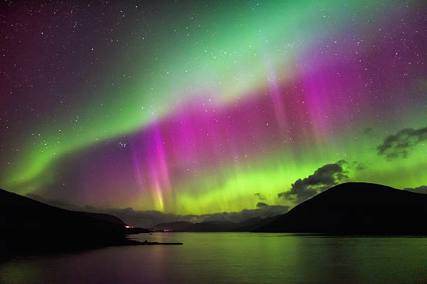 Aurora Borealis - Northern lights, Garve, highlands Scotland Aurora Borealis, also known as the Northern loights, putting a show on dancing over Loch Glascarnoch, by Garve, Highlands of Scotland, UK. northern lights stock pictures, royalty-free photos & images