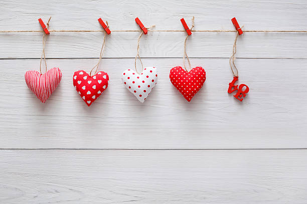 istock Valentine day background, pillow hearts border on wood, copy space 637911868