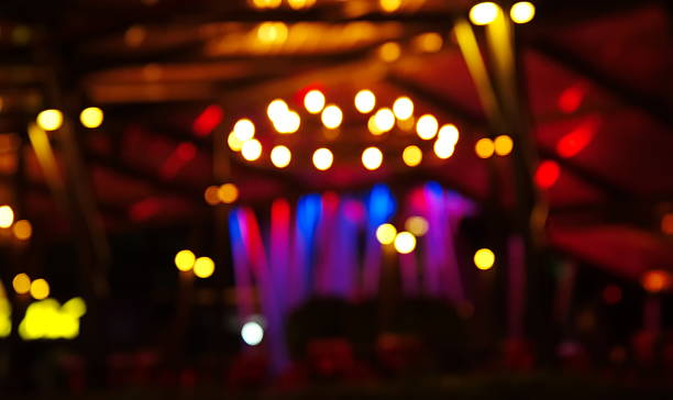 istock blur colorful light at disco pub at dark night background 637912404