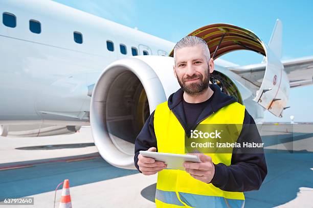 Aircraft Mechnic In Front Of Aircraft Engine Stock Photo - Download Image Now - Occupation, Airport, Airplane
