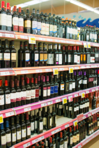 istock Blurred image of shelves with alcoholic drinks in supermarket. 637913256