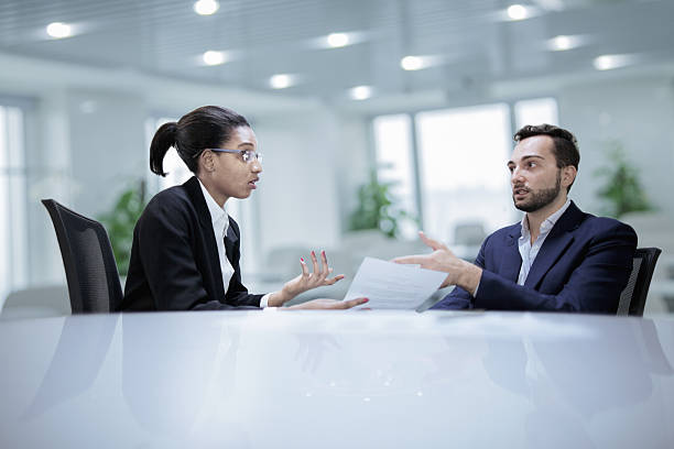 Colleagues working together during discussion in office