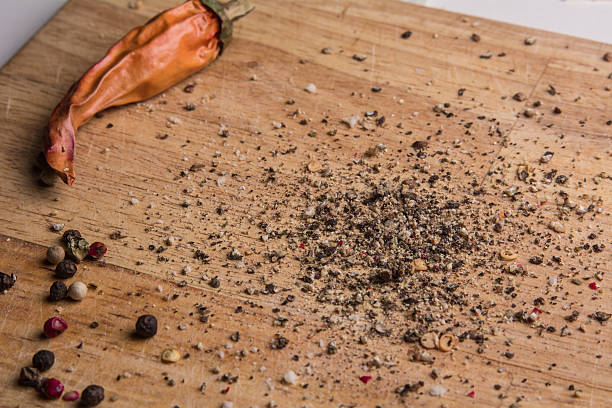 istock In the kitchen chopping board ground pepper and peas 637915194
